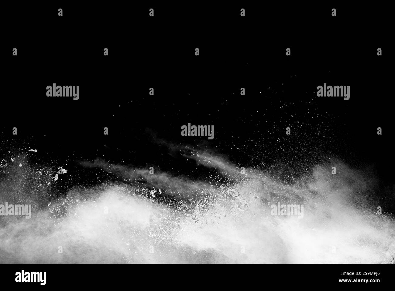 White powder explosion isolated on black background.White dust ...