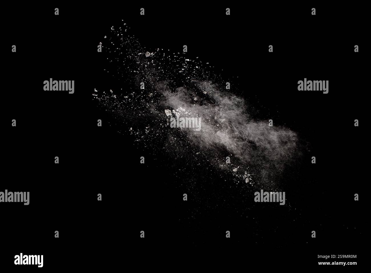 White powder explosion isolated on black background.White dust ...