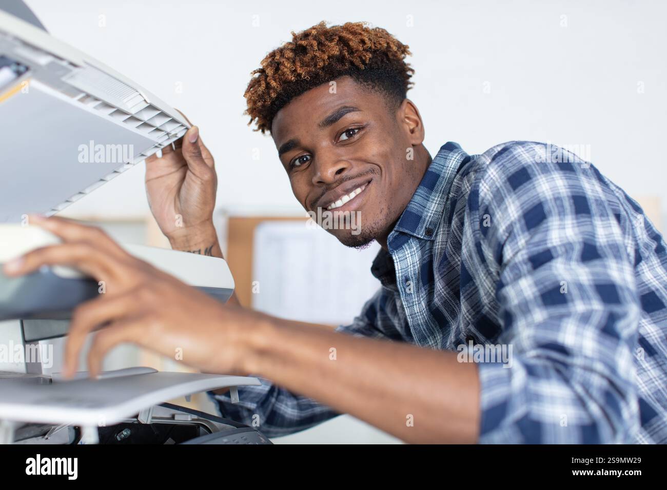 man working on professional printer Stock Photo