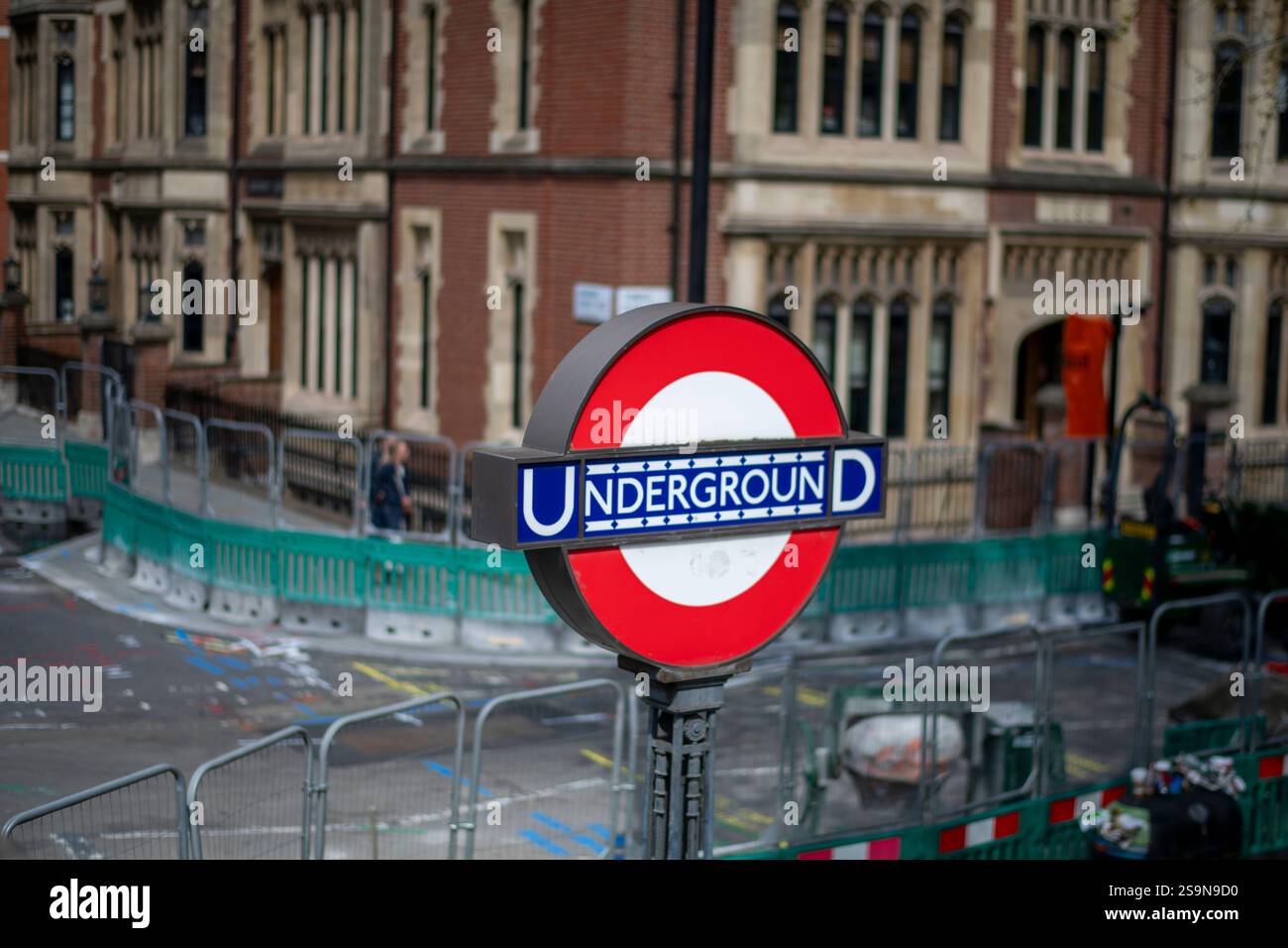 Underground tube sign in busy construction area London England Stock Photo