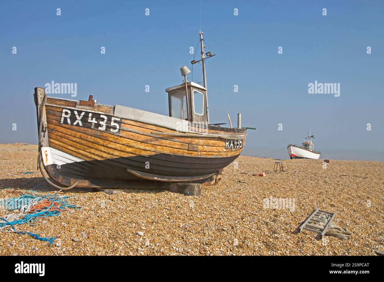 wooden fishing boats on the shingle beach at dungeness on the kent ...