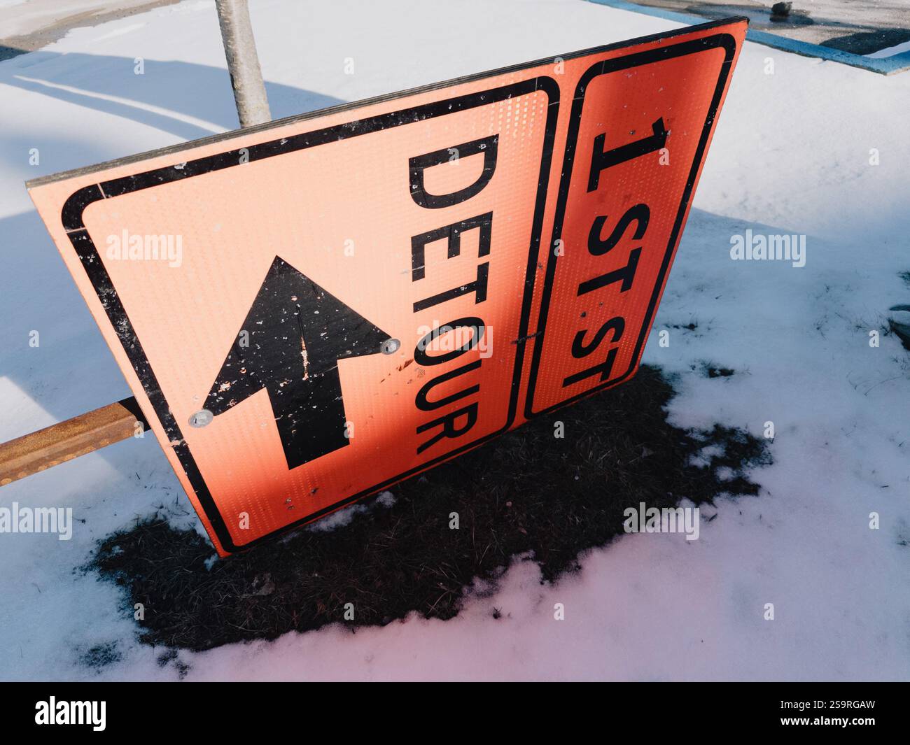 Fallen temporary Detour sign in downtown Flint Michigan USA Stock Photo