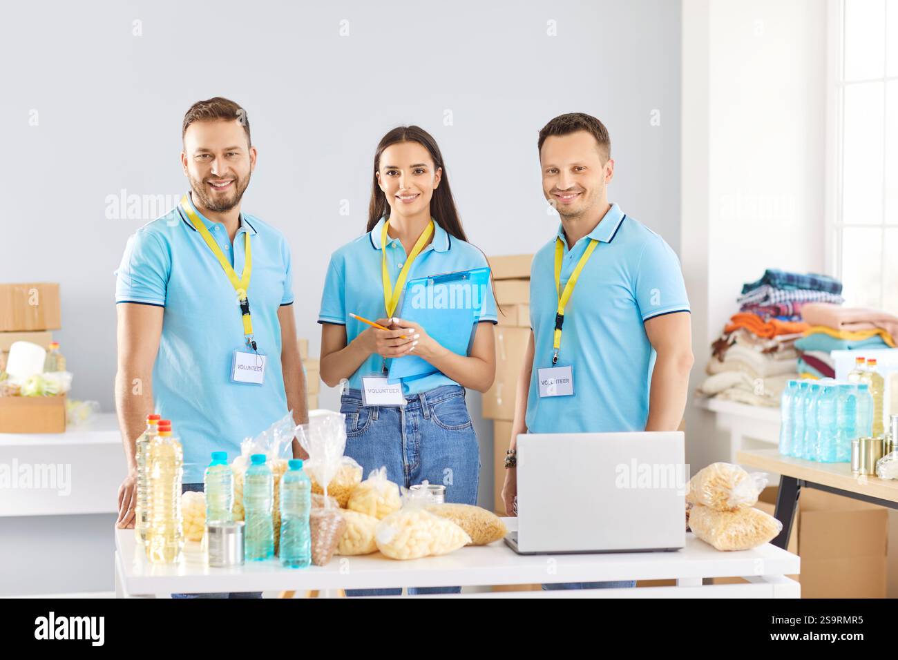 Team of volunteers working at non profit organization that helps refugee shelters Stock Photo