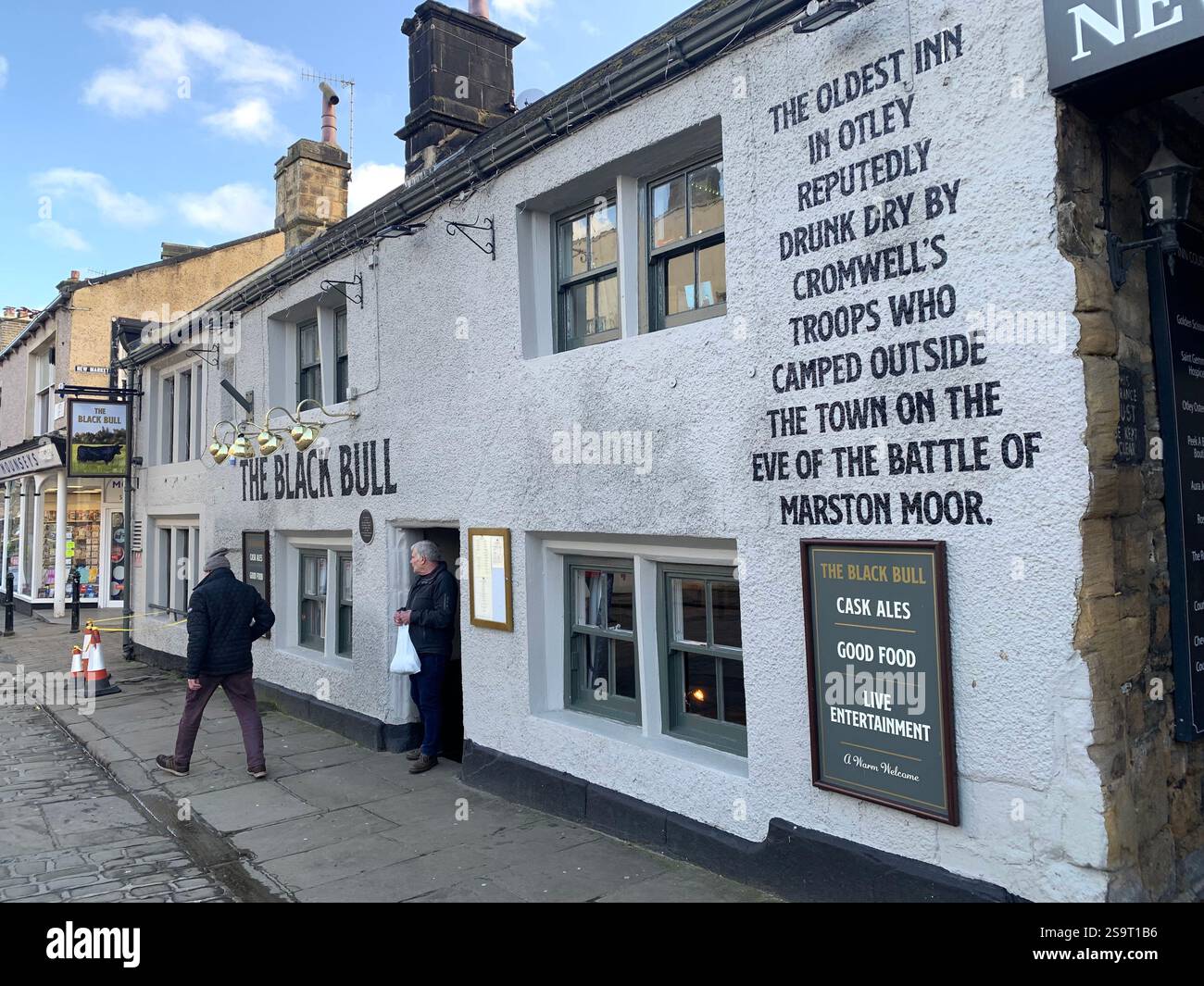 Otley Yorkshire town village place town street streets sign signs shop shops shopping shoppers life living  local pub Cromwell army history life - Smartphone Captured Stock Image