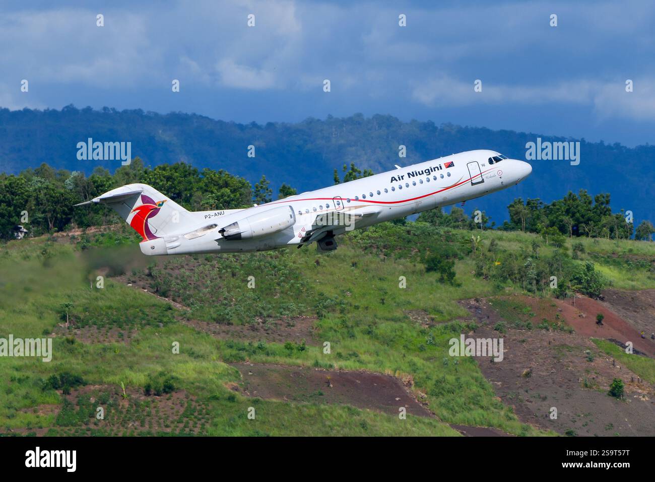 Air Niugini Fokker F70 airplane taking off. Aircraft Fokker 70 of Air Niugini. Fokker F70 plane. Stock Photo