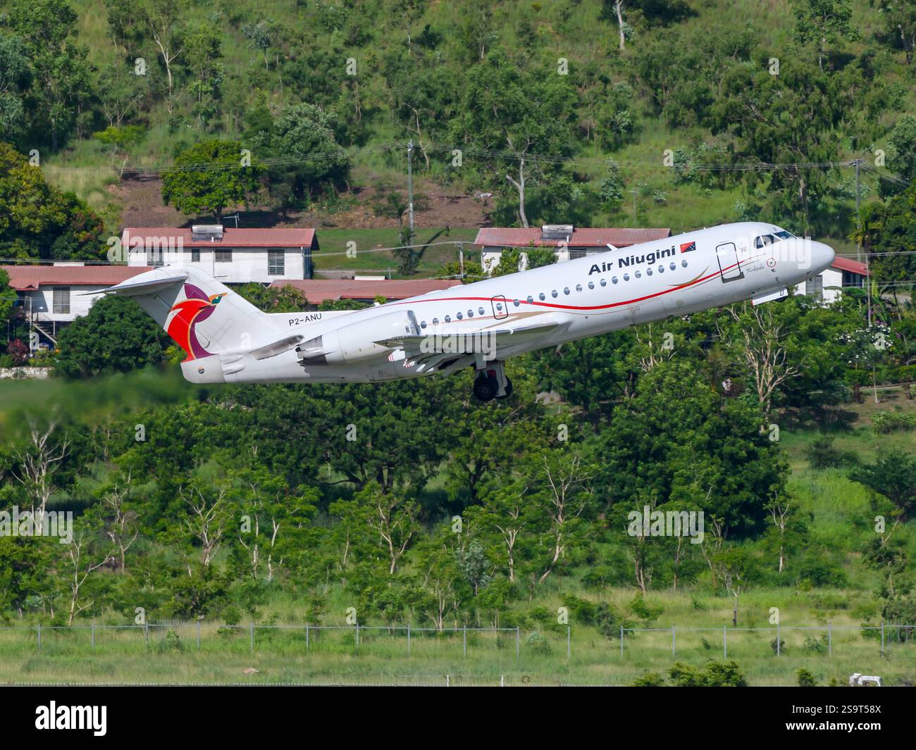 Air Niugini Fokker F70 airplane taking off. Aircraft Fokker 70 of Air Niugini from Papua New Guinea. Fokker F70 plane. Stock Photo
