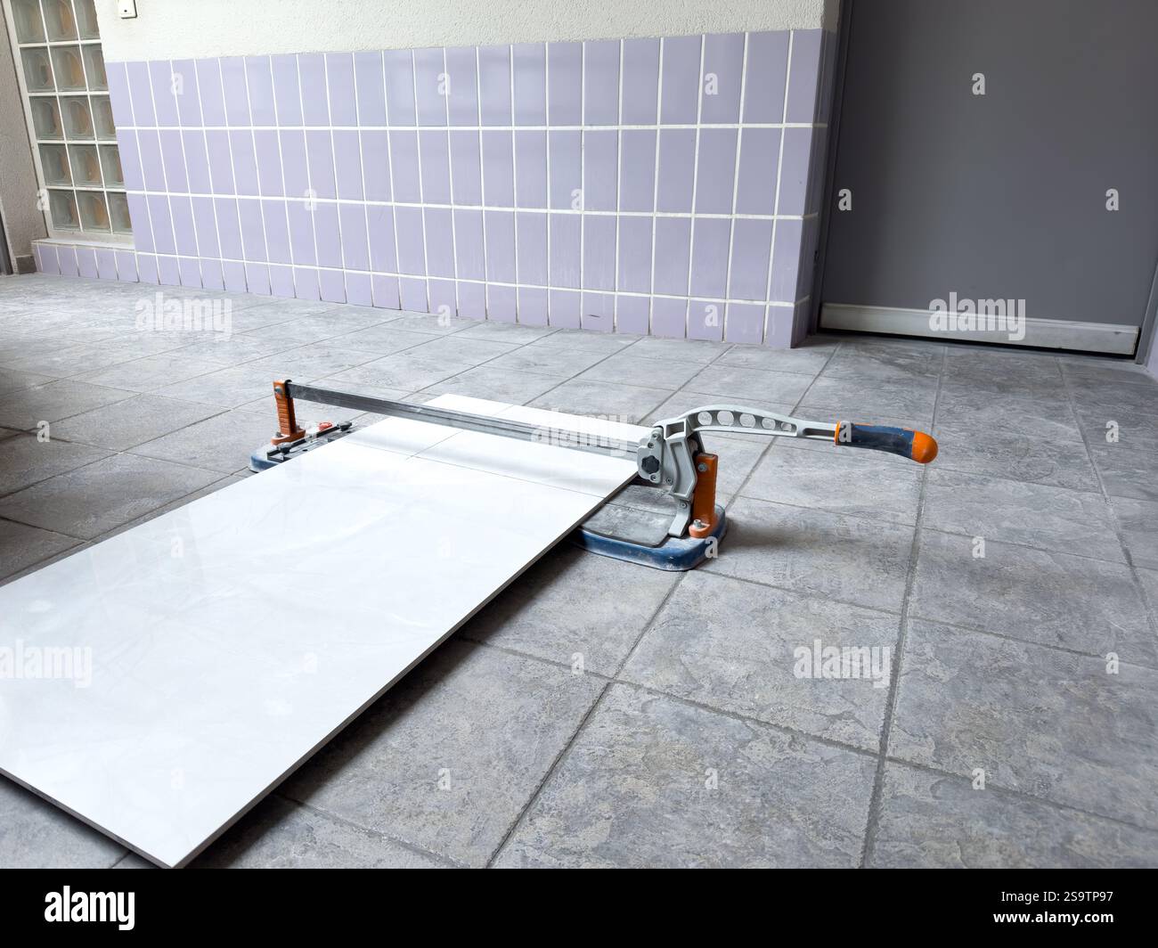 Tile Clean Cutter Tile cutter set for precision work on a bright, clean workshop floor ...