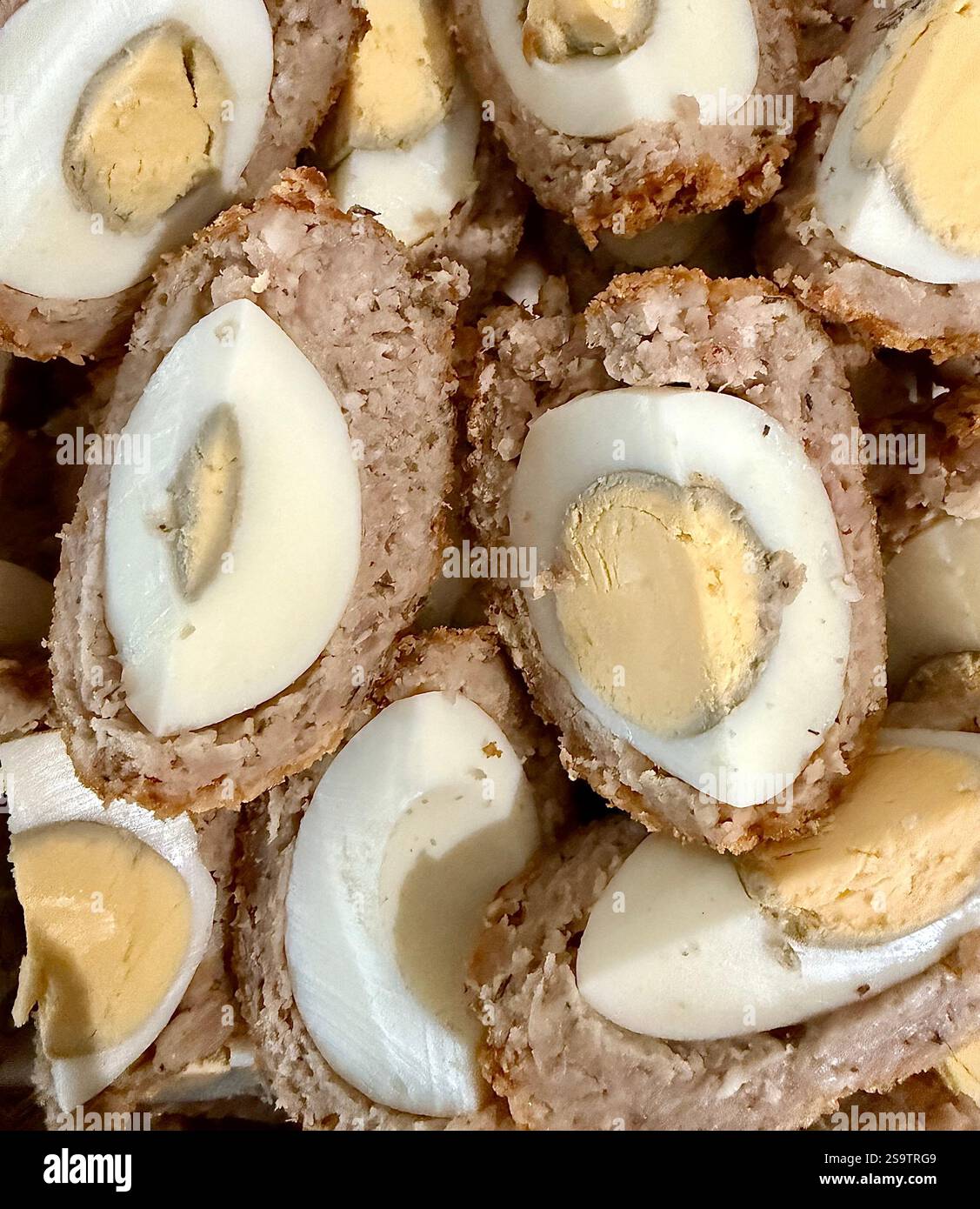 Homemade Deep Fried Scotch Eggs cut into quarters - Smartphone Captured Stock Image