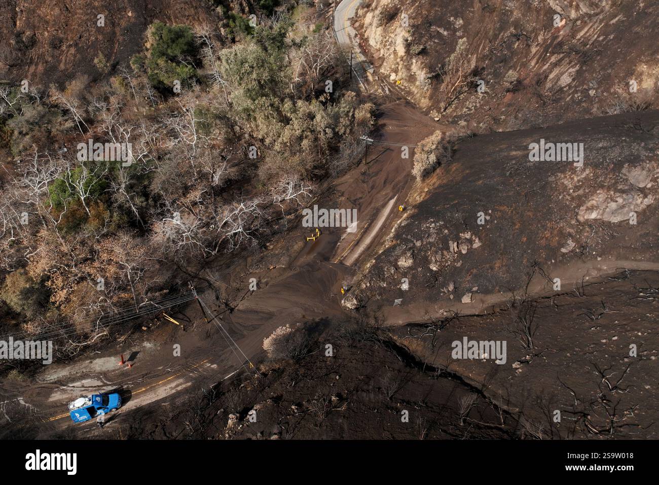 Mud covers Topanga Canyon Rd. on the Palisades Fire burn area after a