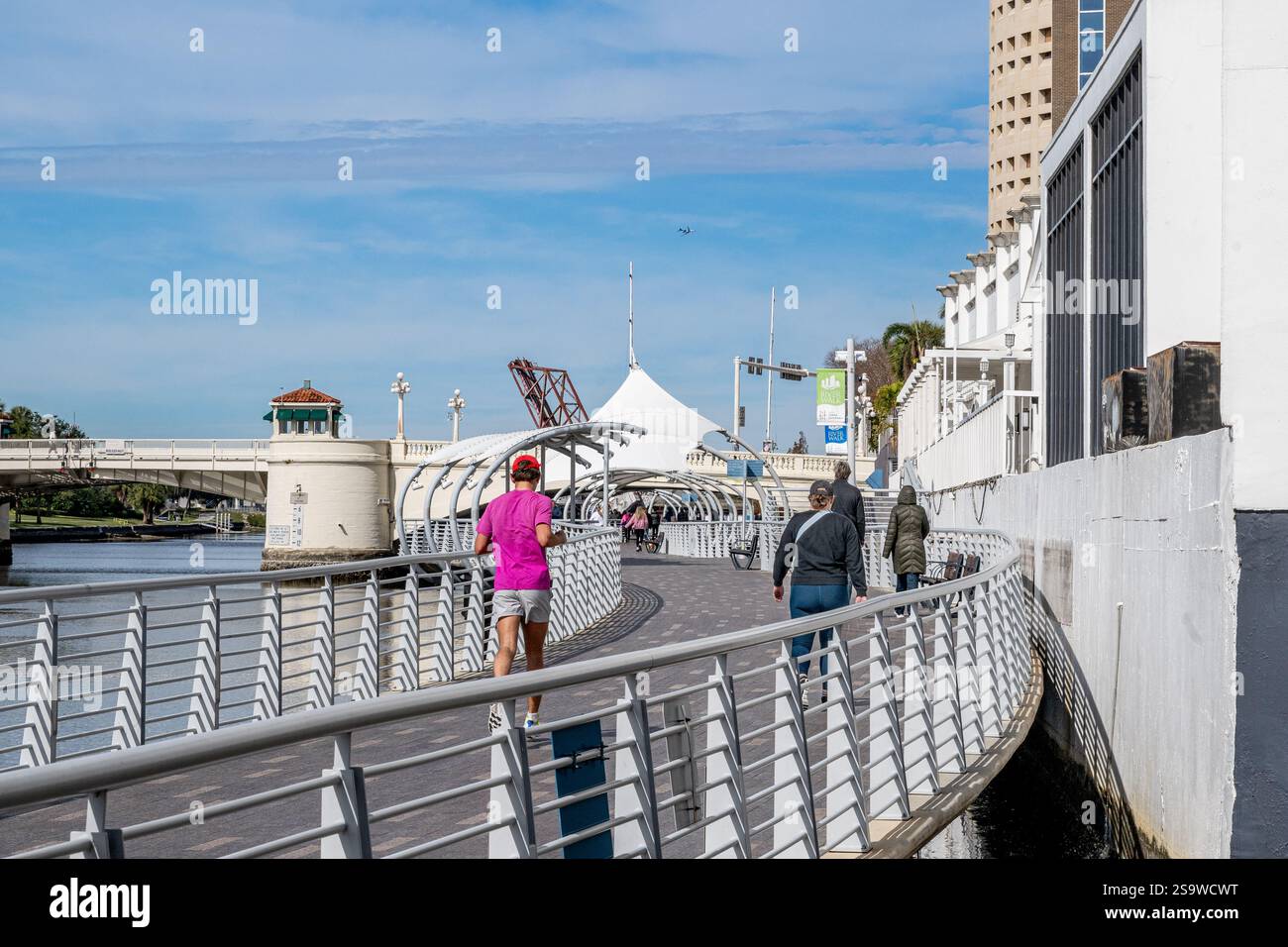 Tampa Bay riverwalk running and walkers exercising - Tampa Hillsborough