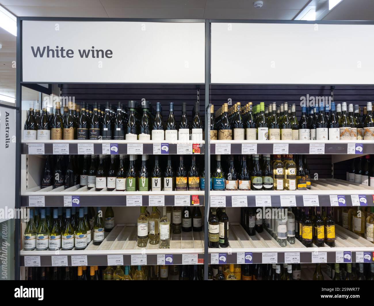 White wine aisle in a Sainsbury's supermarket, with wine bottles from different countries, UK. Concept: cost of living, alcohol sales, shoplifting - Smartphone Captured Stock Image