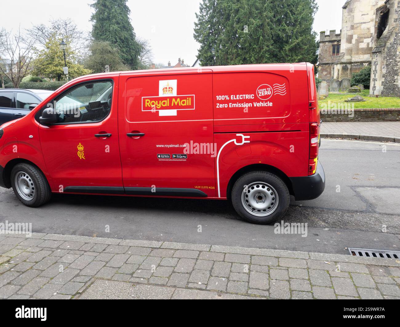 100% electric zero emissions vehicle - Royal Mail postal delivery van with Royal Mail livery and logo, Basingstoke, England. Concept: carbon reduction - Smartphone Captured Stock Image
