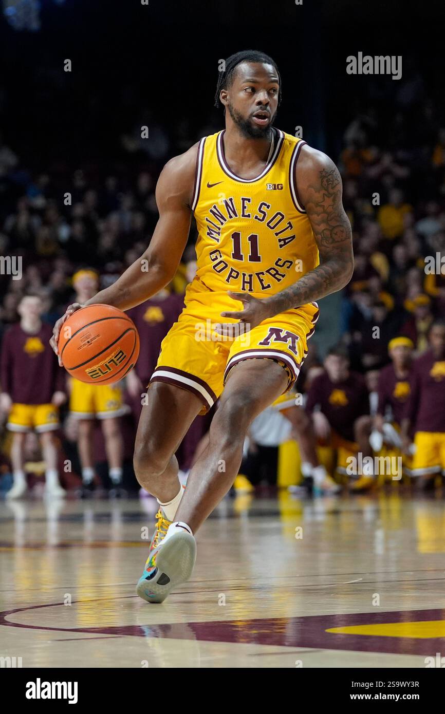 Minnesota guard Femi Odukale (11) dribbles down the court during the