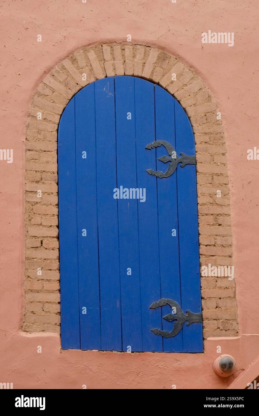 Marrakech, Morocco. Blue gate situated on old wall. Stock Photo