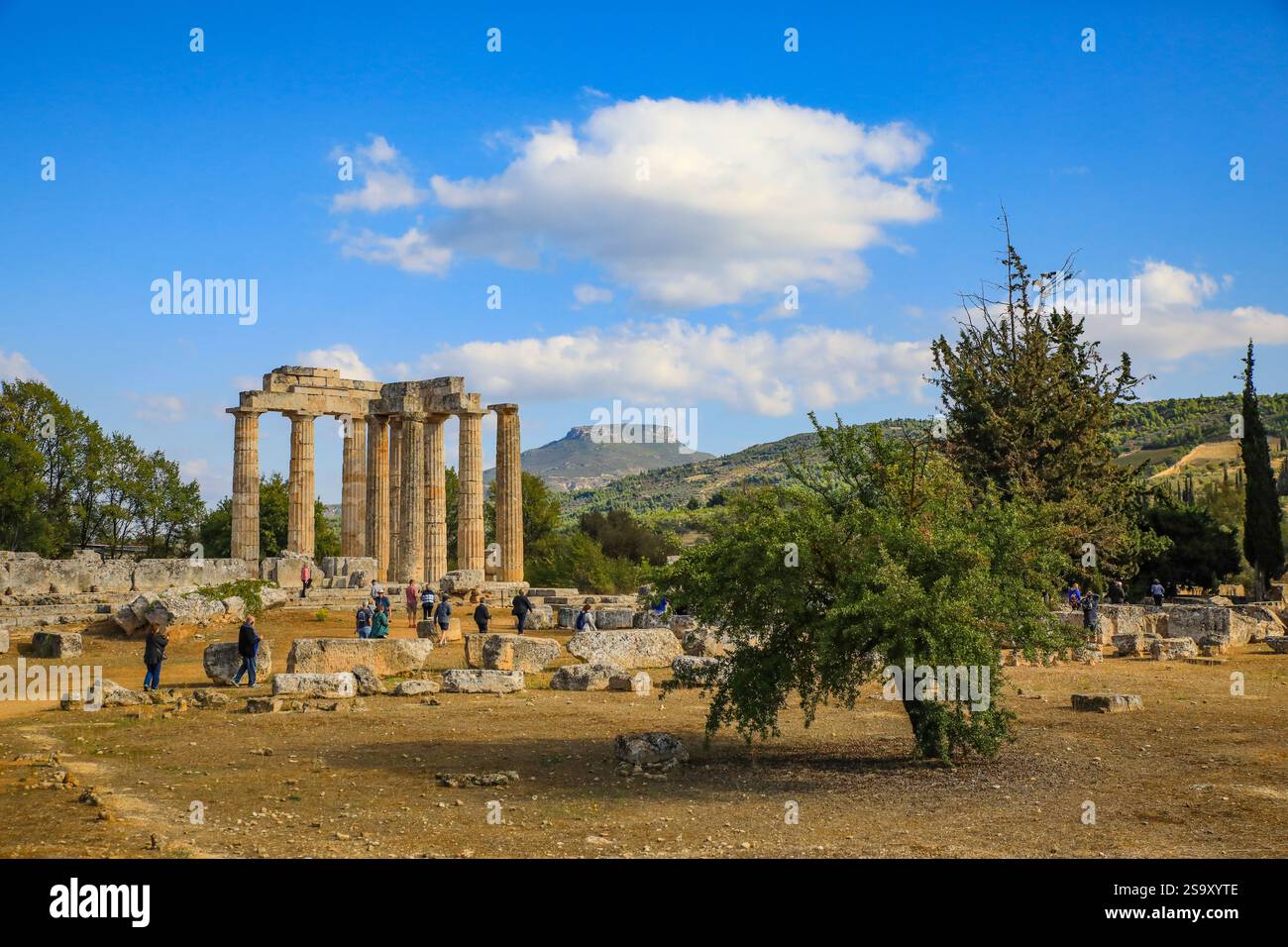 Nemea, Greece. Ancient city of Nemea with Doric columns and tourists Stock Photo