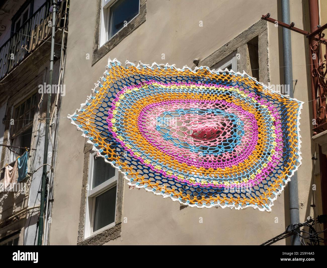 Closeup of a crocheted doily hanging in the streets of Coimbra Stock ...
