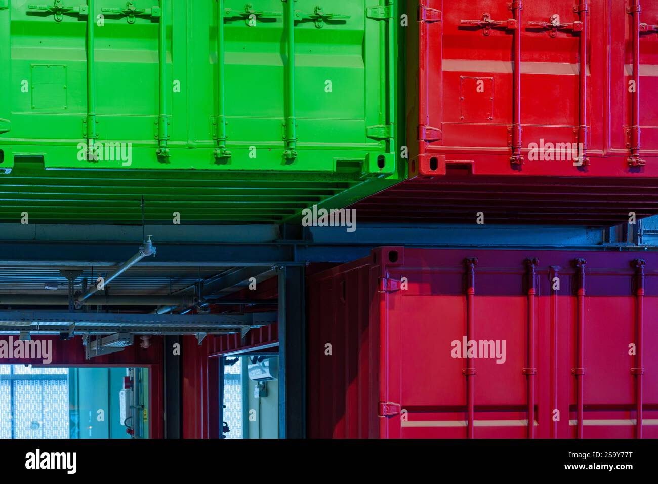 View of warehouse building with various colorful shipping containers ...