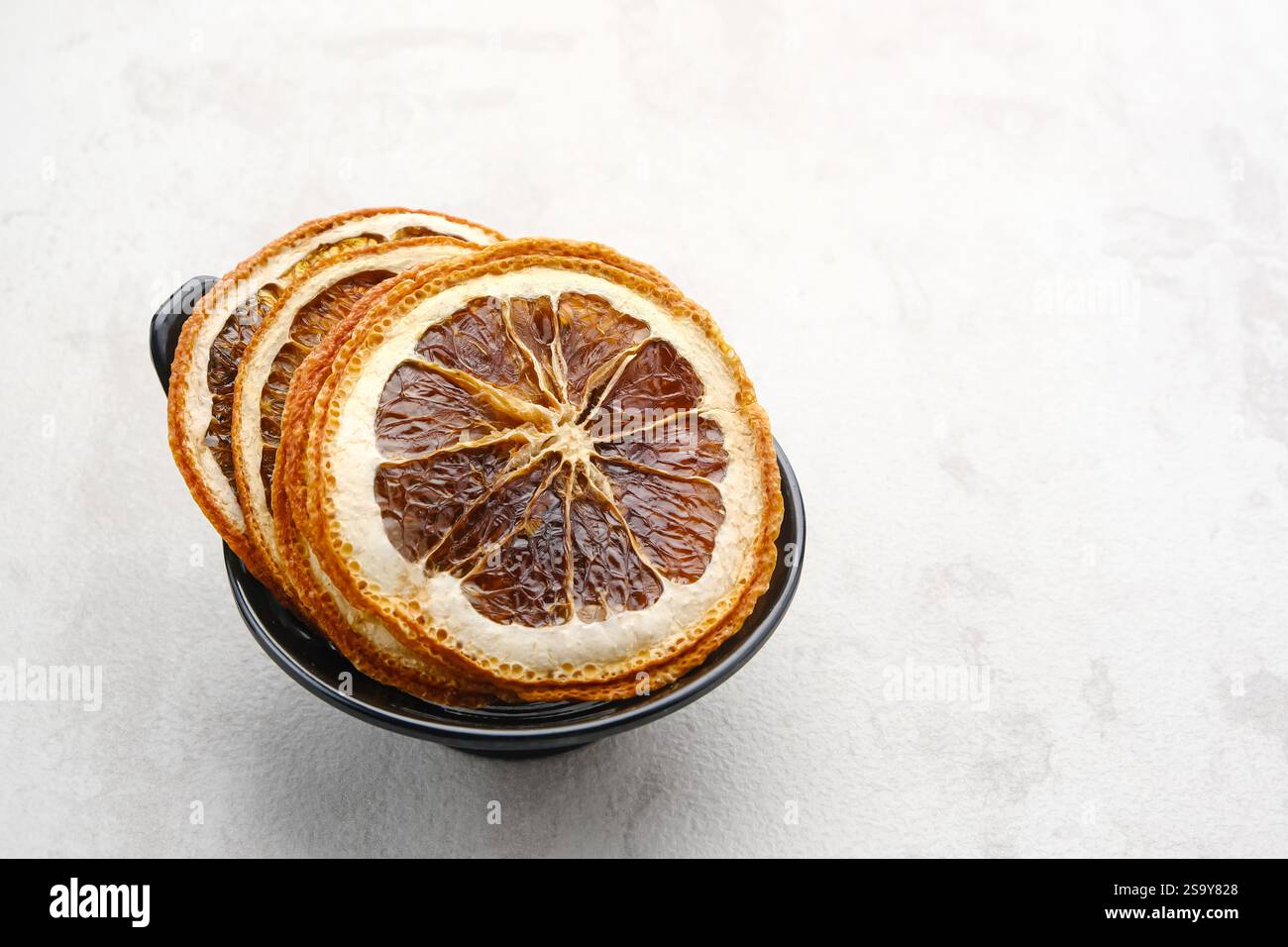 Dried orange slices on white background Stock Photo
