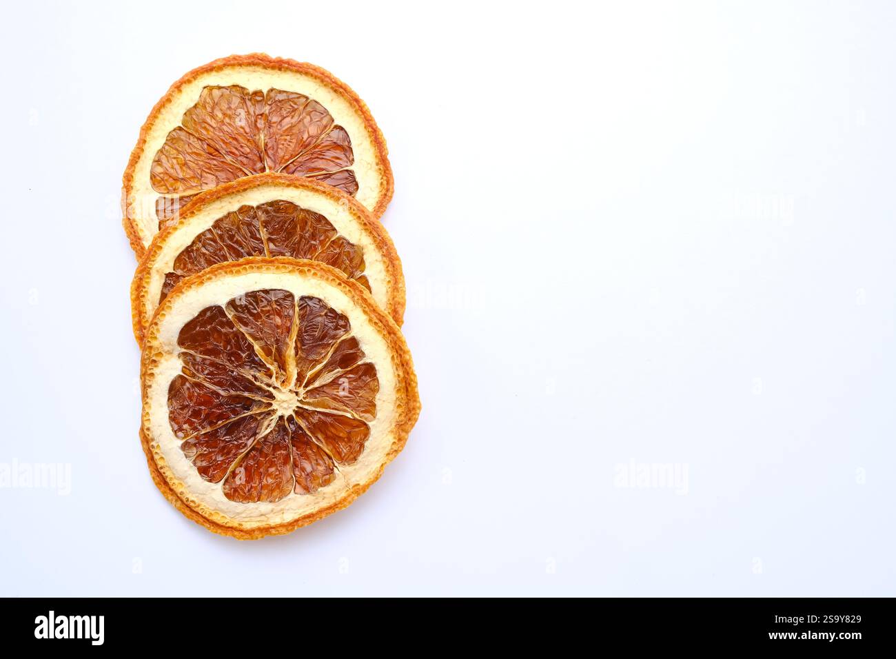 Dried orange slices on white background Stock Photo