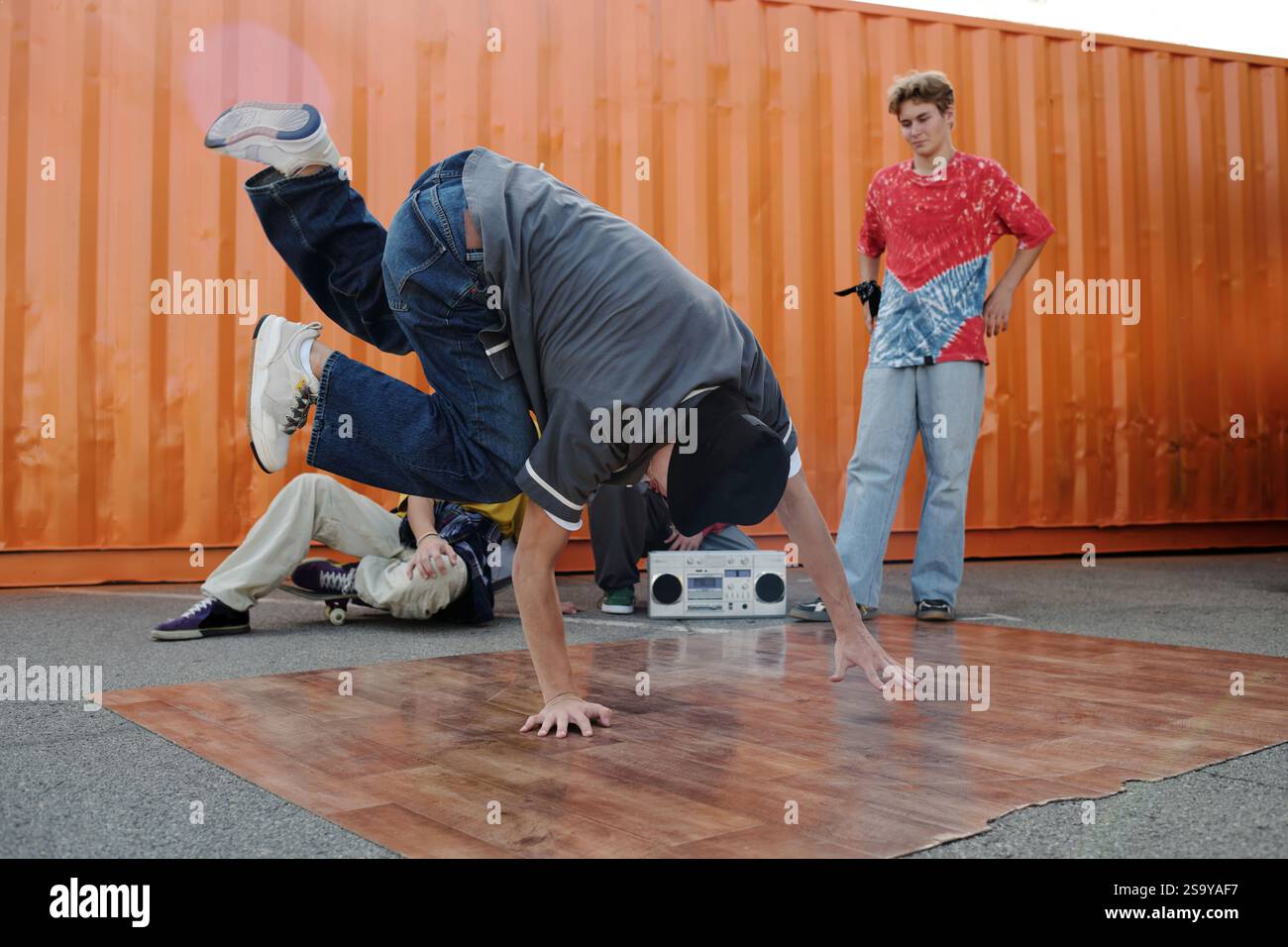 Dancing Breakdance Outdoors with Boombox and Friends Watching Stock ...