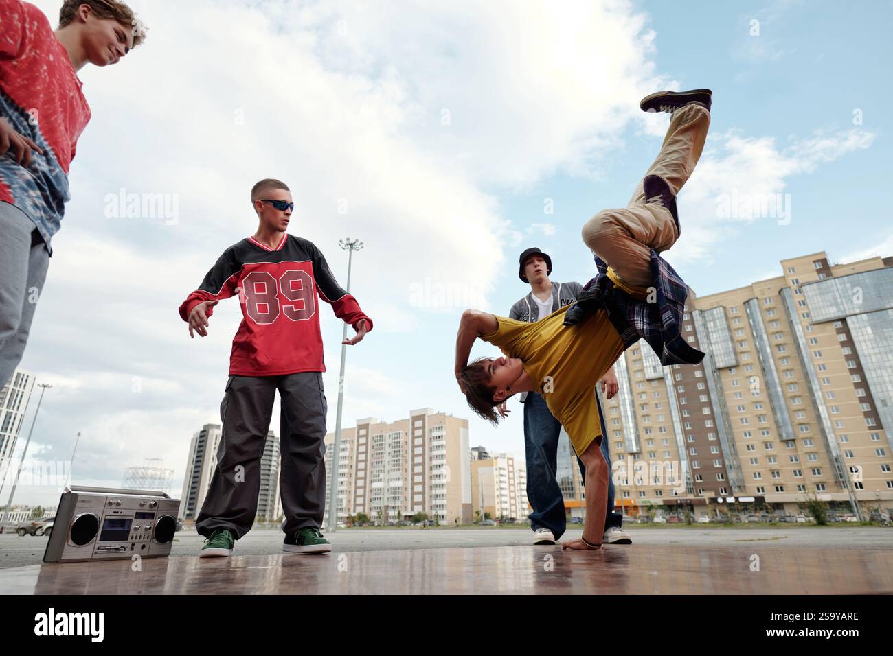 Performing Breakdancing Moves in Urban Environment Stock Photo