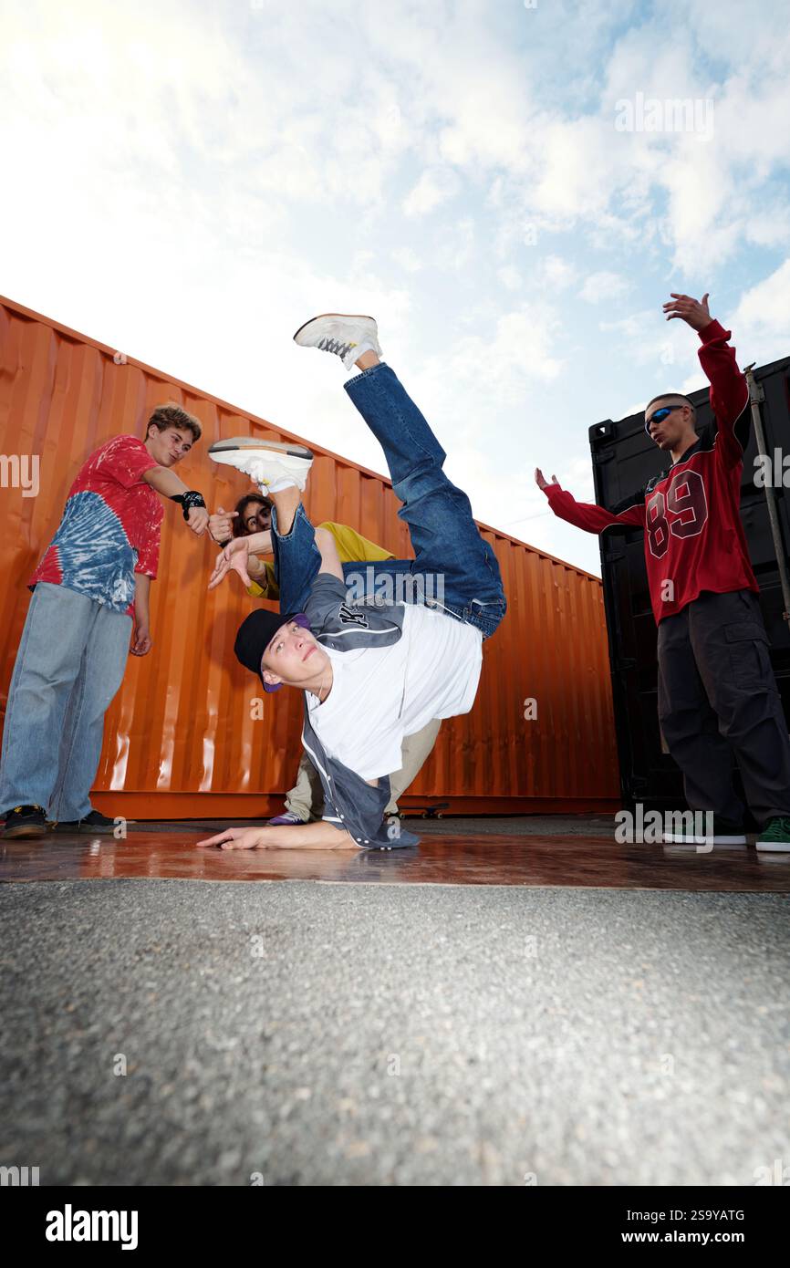 Breakdancing Performance by Young Hip-Hop Dancers Outdoors Stock Photo