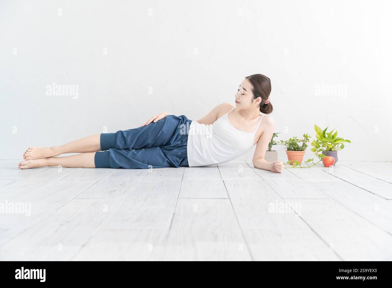 Young woman doing light exercise Stock Photo - Alamy