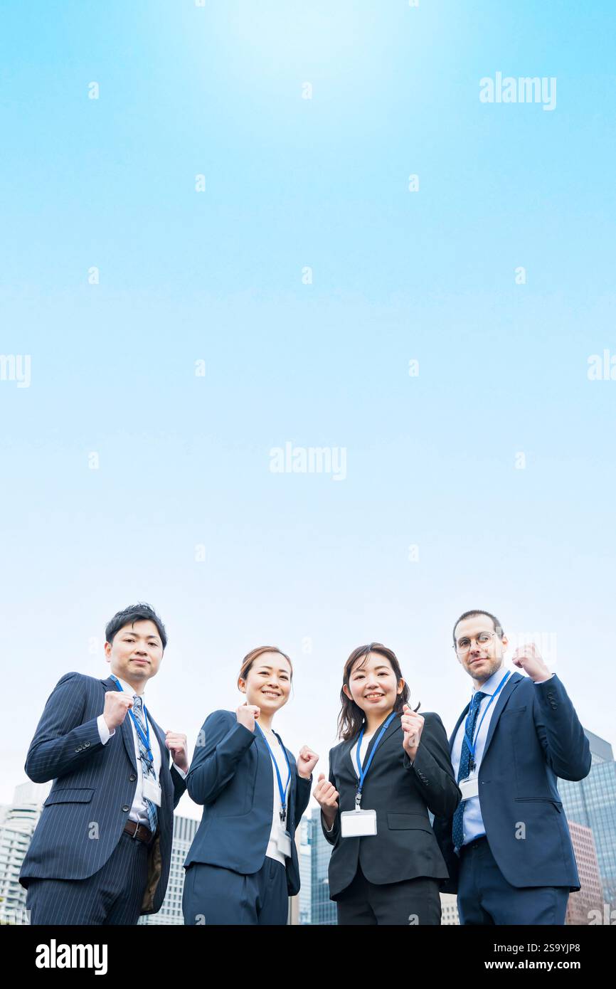 Business team posing for cheering Stock Photo - Alamy
