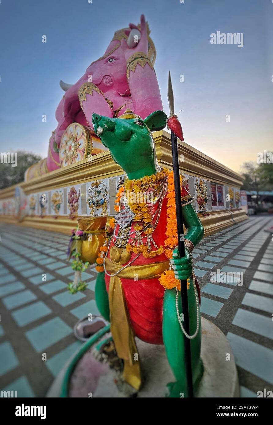 Green rat and pink Ganesha statue in Chachoengsao province near Bangkok - Smartphone Captured Stock Image