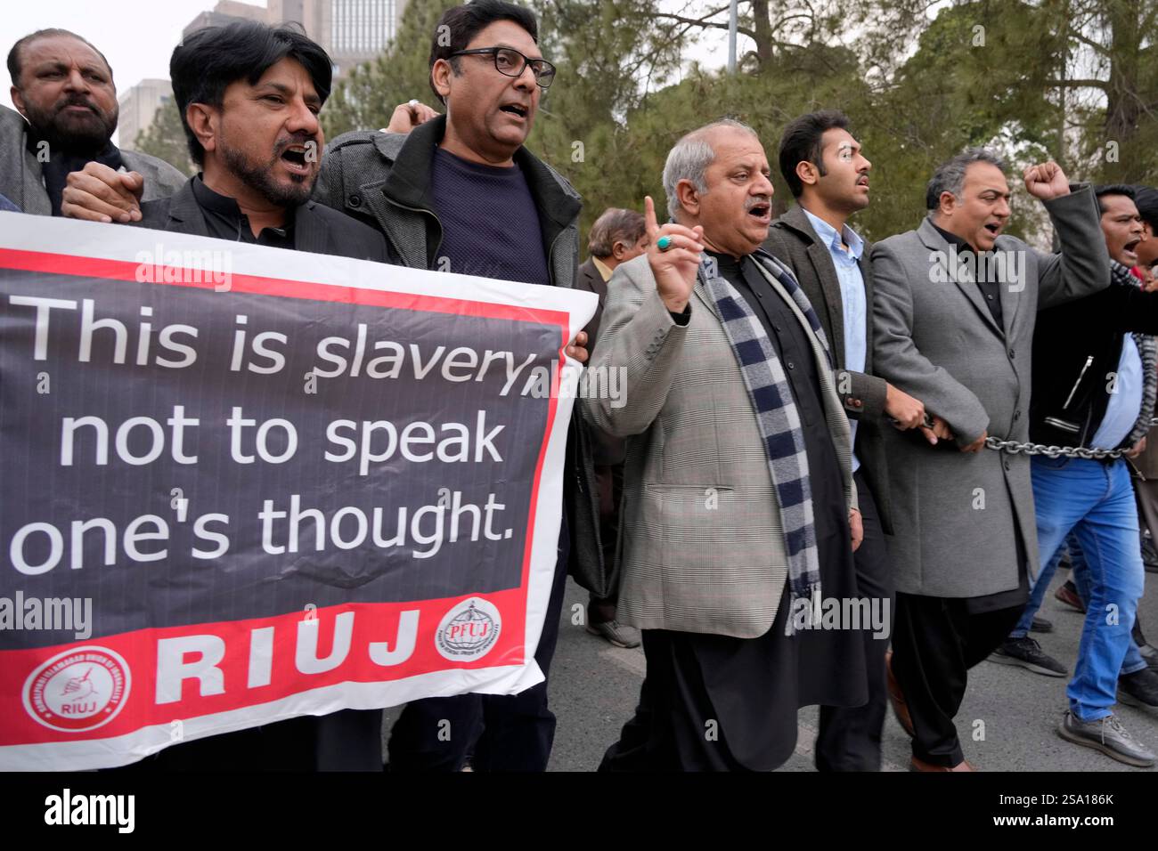 Journalists chant slogans during a protest rally, in Islamabad ...