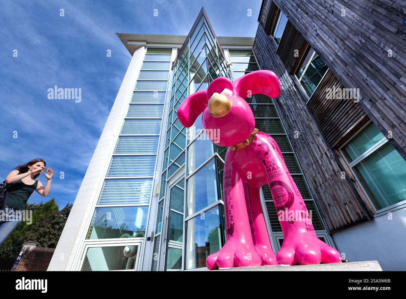 Bristol, UK. A view of the Aardman Animations building and studios. A Gromit sculpture from the Gromit Unleased Trail stands in front of the building Stock Photo