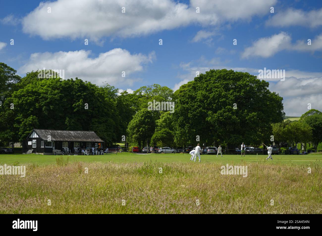 Scenic rural cricket ground (competitive summer sporting fixture ...