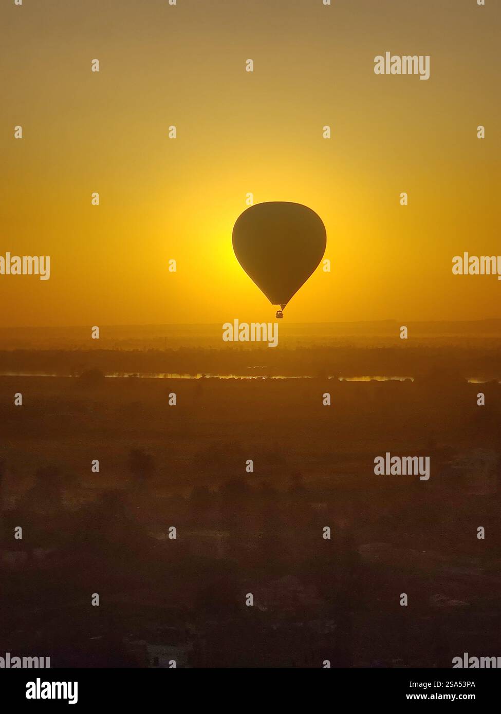 Drifting over the Valley of the Kings, embraced by the golden glow of sunrise. - Smartphone Captured Stock Image