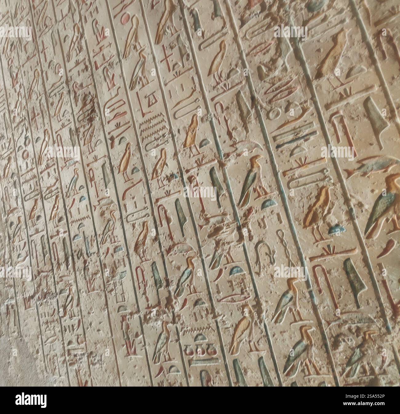 Vividly preserved hieroglyphs from a tomb in the Valley of the Kings, showcasing the artistry and spiritual significance of ancient Egyptian funerary - Smartphone Captured Stock Image