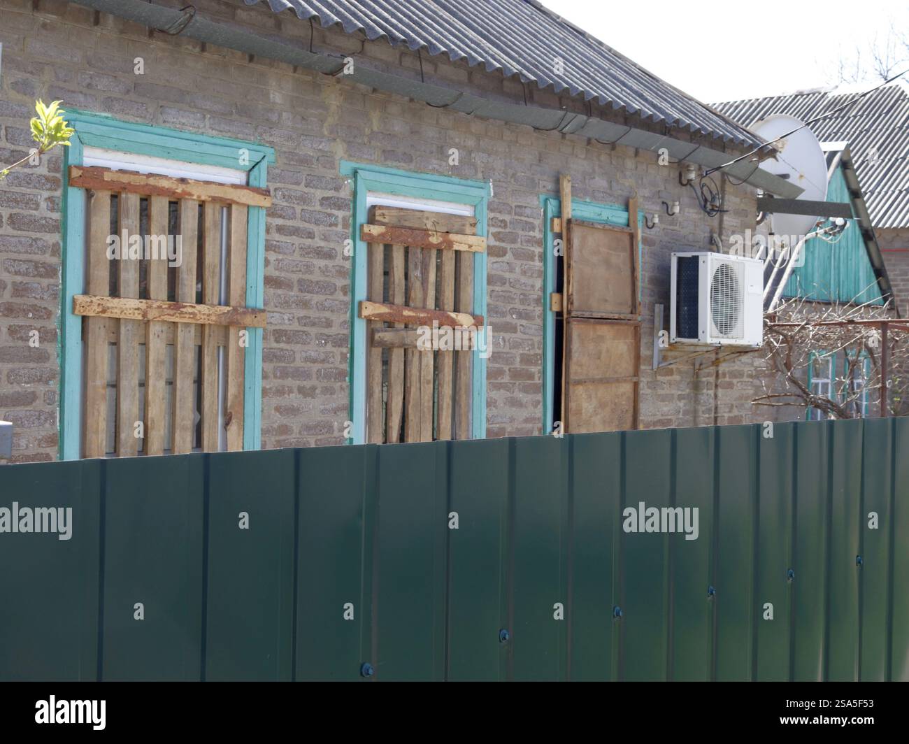 Boarded up windows of individual houses to protect against bombing and ...