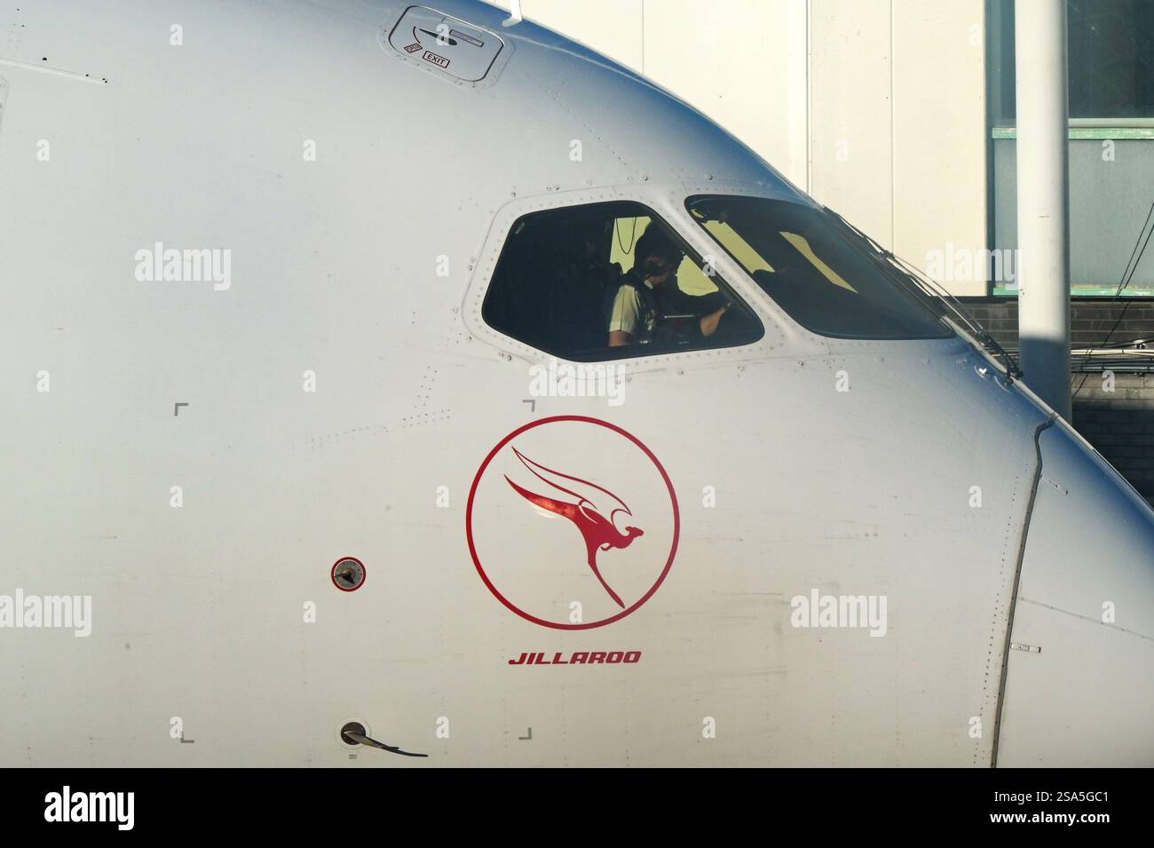 London, England, UK - 3 January 2025: Cockpit with pilots on a Boeing 787 jet (registration VH-ZNG) operated by Australian airline Qantas at London H Stock Photo