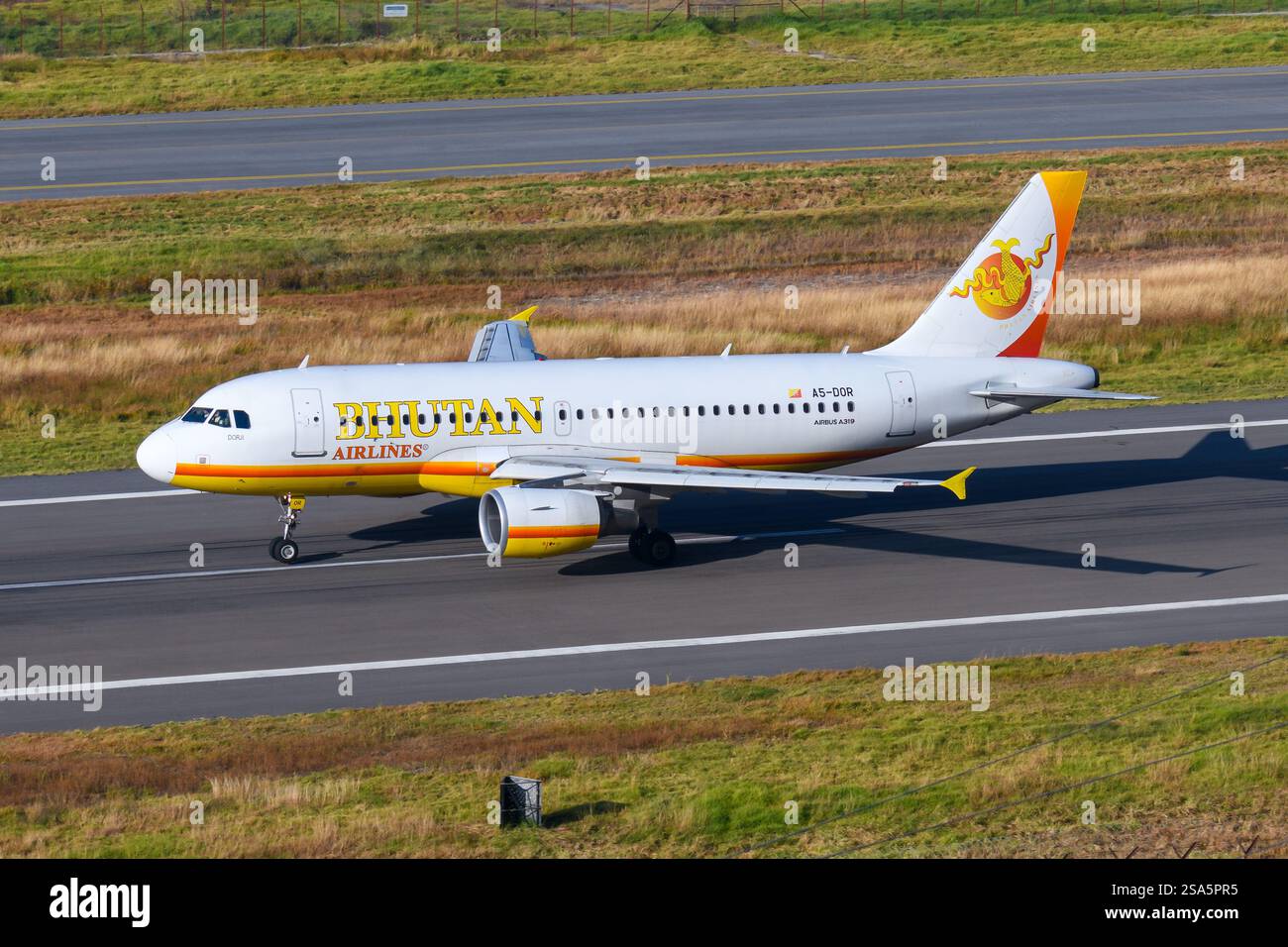 Bhutan Airlines Airbus A319 airplane taking off from Paro Airport in Bhutan. Airline Bhutan Airlines aircraft departing. Stock Photo