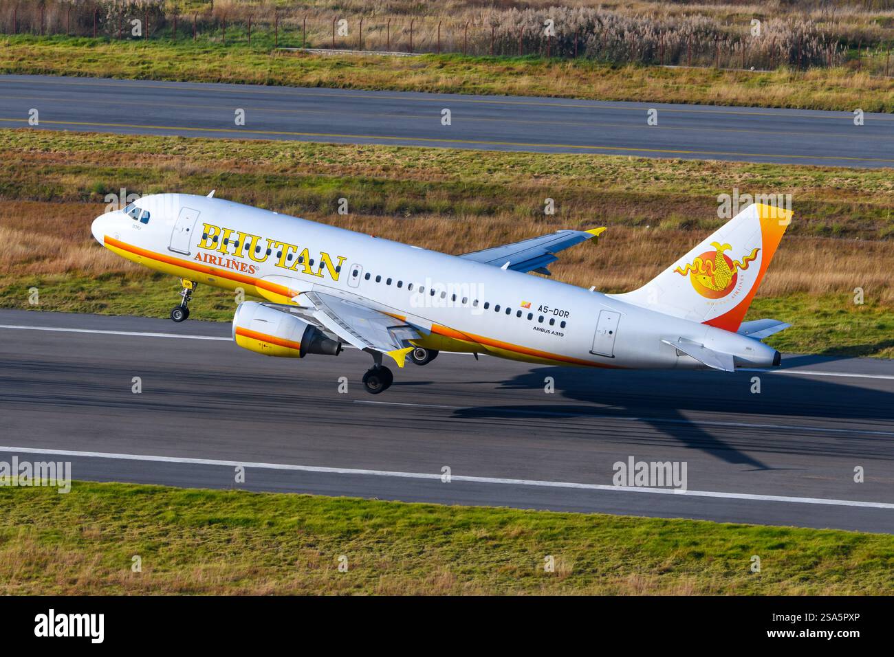 Bhutan Airlines Airbus A319 airplane taking off from Paro Airport in Bhutan. Airline Bhutan Airlines aircraft departing. Stock Photo
