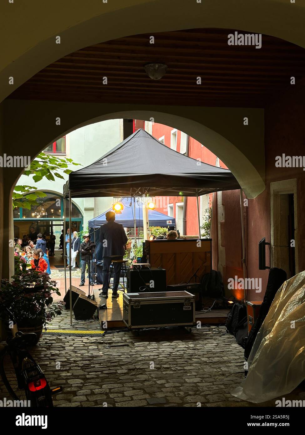 Live Music Performance in a Historic Alleyway in Regensburg, Germany - Smartphone Captured Stock Image