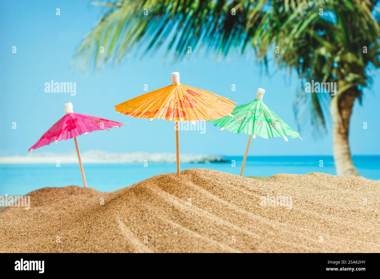 Umbrella on the sand on the background of the beach Stock Photo - Alamy