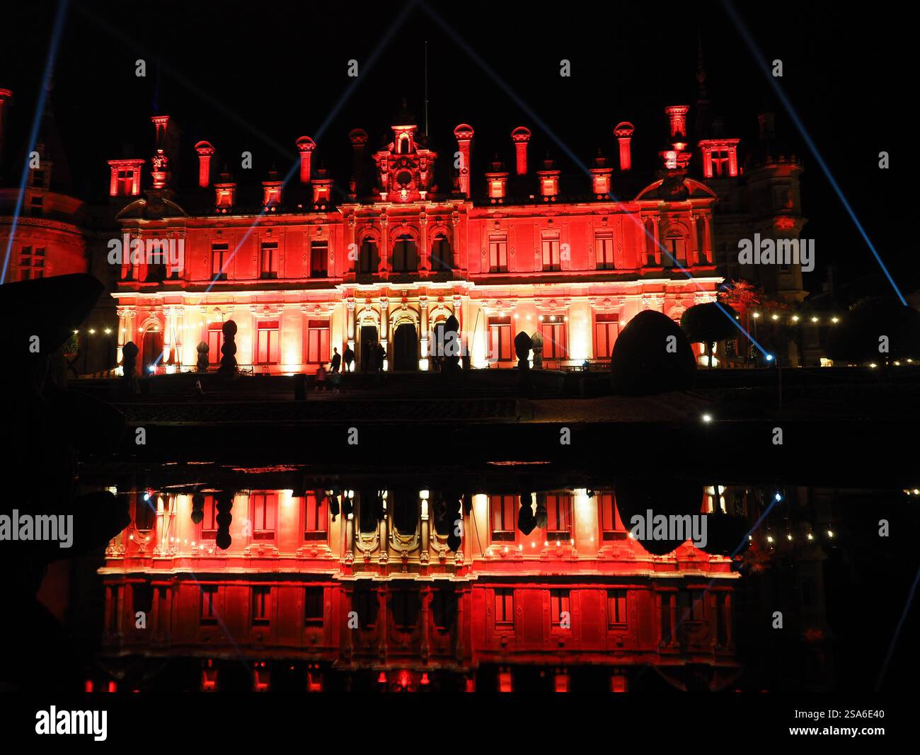 Floodlight Waddesdon Manor reflected in the water Stock Photo