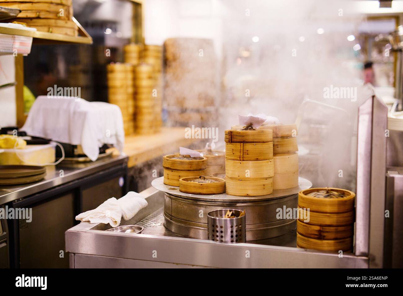 Chinese cuisine dim sum been cooked in steamer baskets at traditional ...