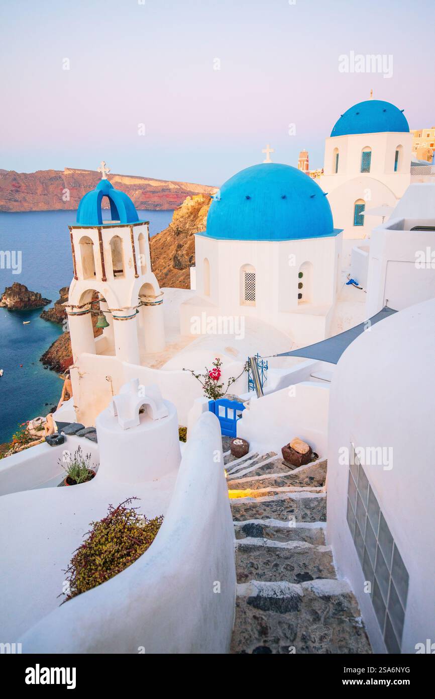 blue-domed-church-in-oia-overlooking-spectacular-caldera-surrounding