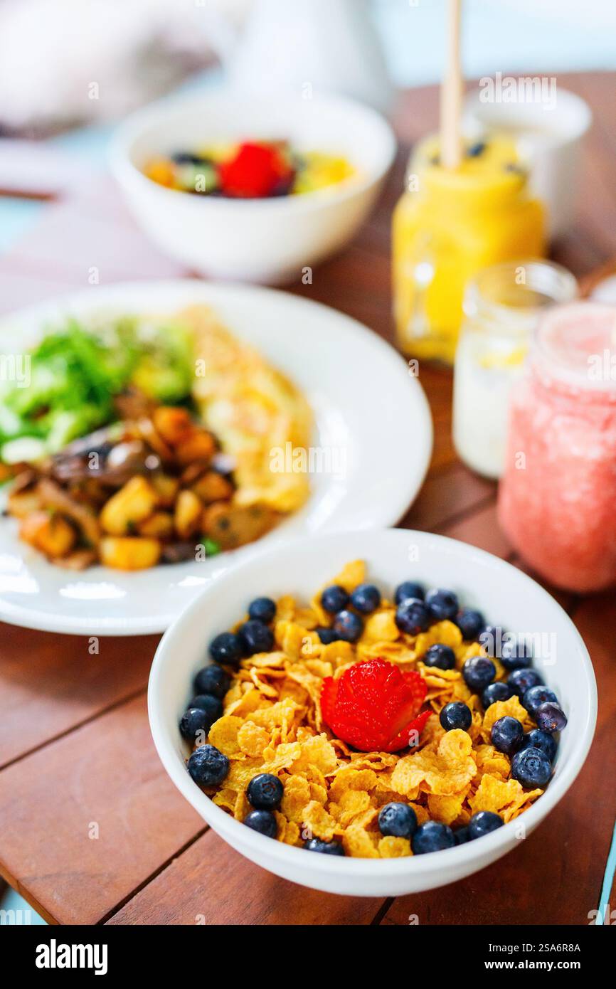 Delicious cereal with milk and fresh berries served for breakfast Stock Photo