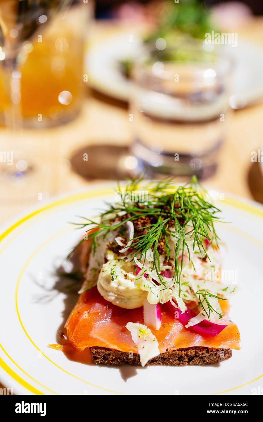 Danish smorrebrod traditional open sandwich with salmon on rye bread Stock Photo