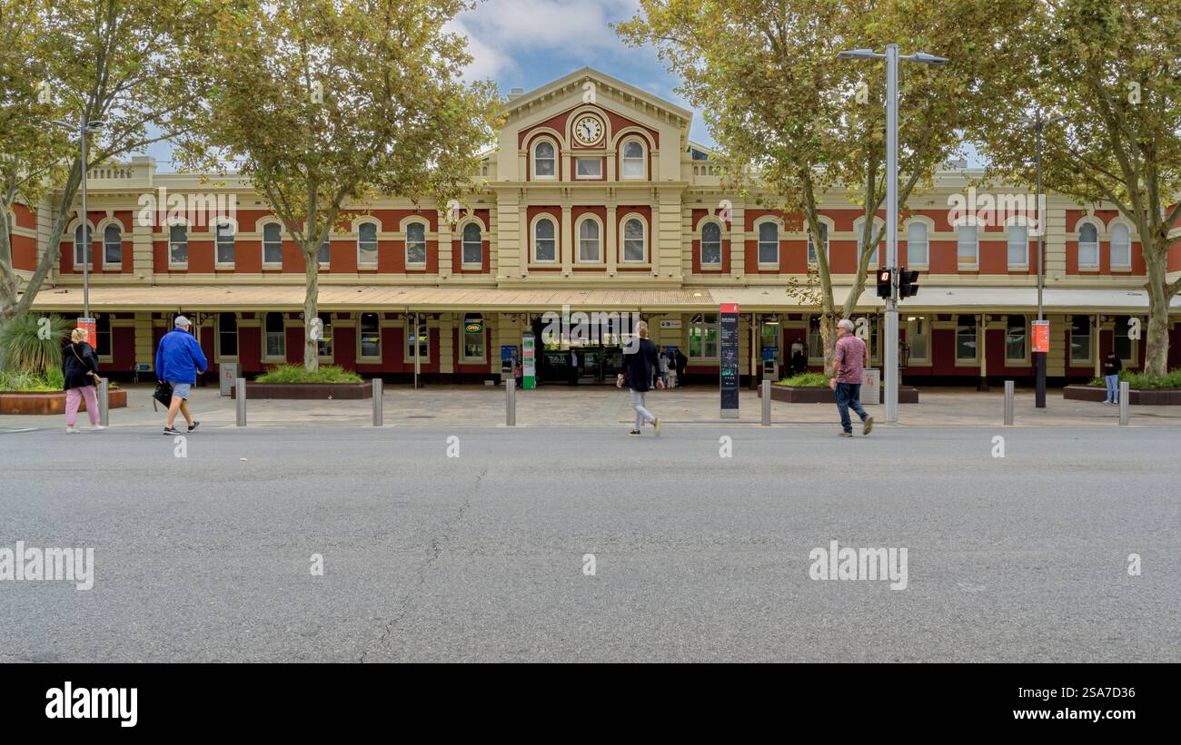 People crossing the street to enter the Perth Railway Station, Western Australia. Stock Photo