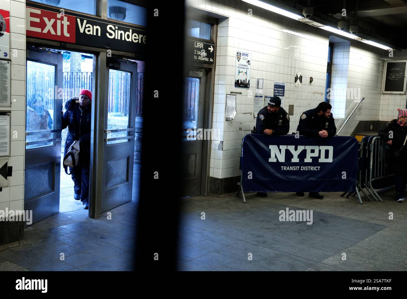 New York City police officers stand at aubway entrance on January 28 ...