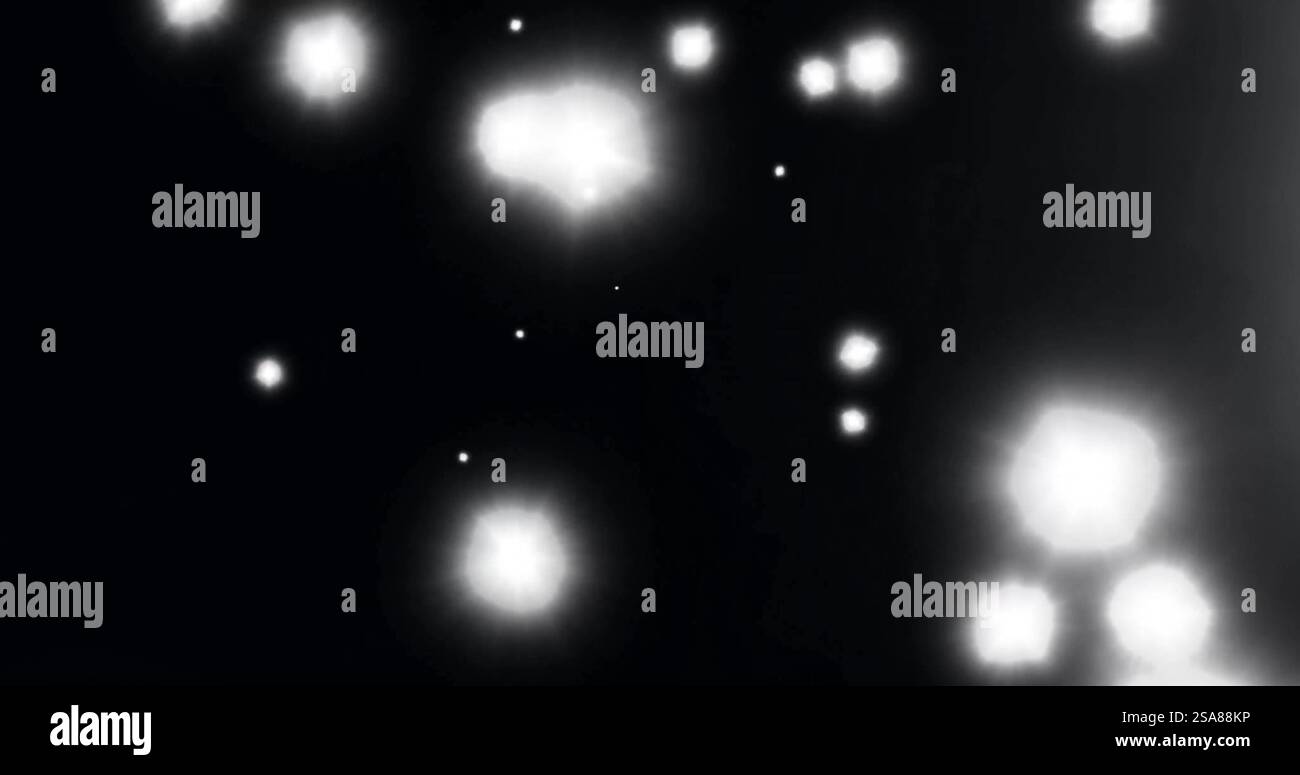 Image of glowing light spots moving over black background Stock Photo ...