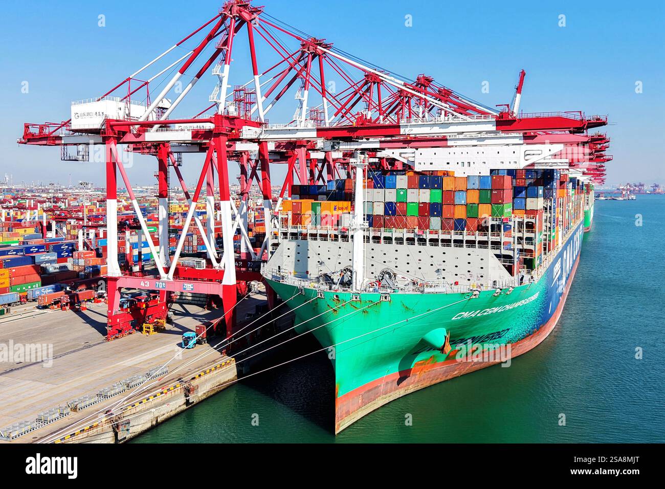 QINGDAO, CHINA - JANUARY 29, 2025 - Cargo ships load and unload foreign ...