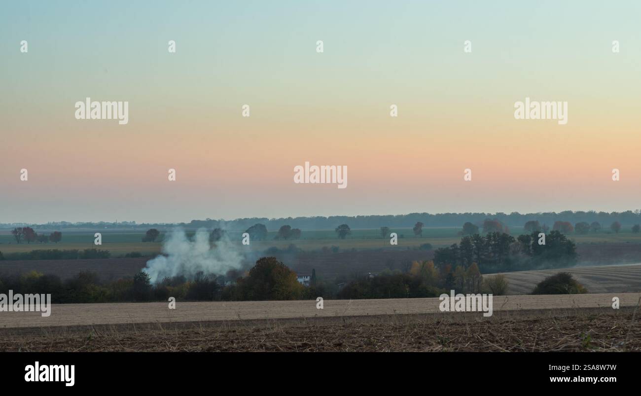 Gentle wisps of smoke rise in hi-res stock photography and images - Alamy